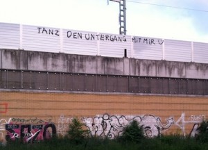 &acirc;Sponti-graffiti&acirc; spotted from the train on the way to the Wedding S-Bahn station. It says &acirc;Tanz den Untergang mit mir&acirc; (Dance [into] the downfall with me) &Acirc;&copy; Virag Molnar