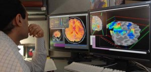 Researcher checking fMRI images. &Acirc;&copy; NIMH | US Department of Health and Human Services