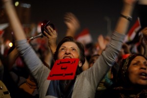 An Egyptian protester holds a red card with Arabic that reads: "Morsi: leave" and shouts slogans against Egyptian President Mohammed Morsi as she watches his speech at Tahrir Square, the focal point of Egyptian uprising, in Cairo, Egypt, Wednesday, June 26, 2013. © Zamanalsamt | Flickr