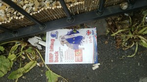 BNP (British National Party) "biting back" poster on the ground in Wythenshawe, UK, May 15, 2014 © Mikey | Flickr