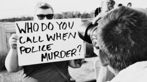 Sign at an anti-police brutality in Dallas © Helium Factory | Flickr