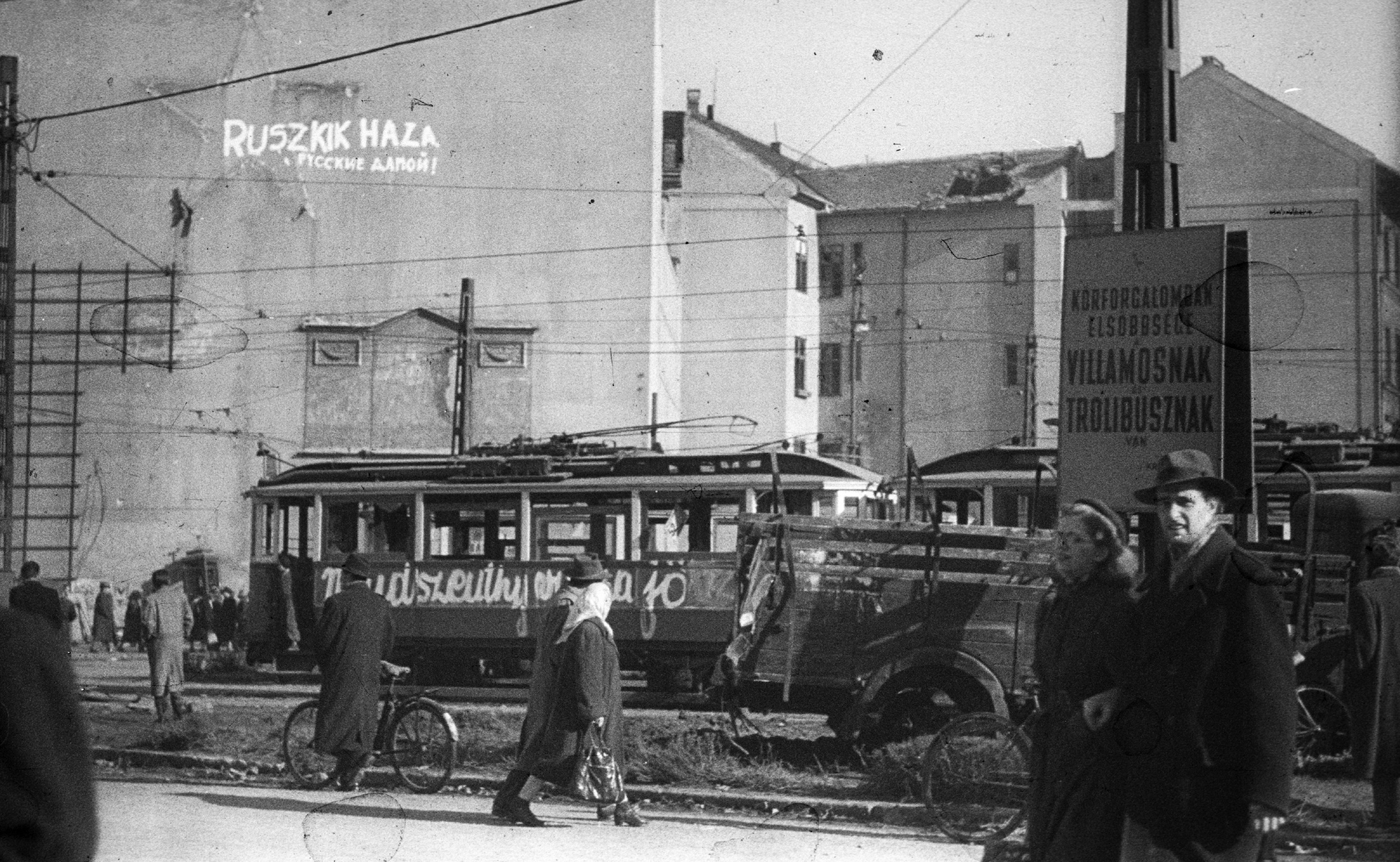 Building façade with contours of a removed red star visible; graffiti reads: âRussians go home!â Downtown Budapest, late October 1956 © Gyula Nagy | Fortepan 40014