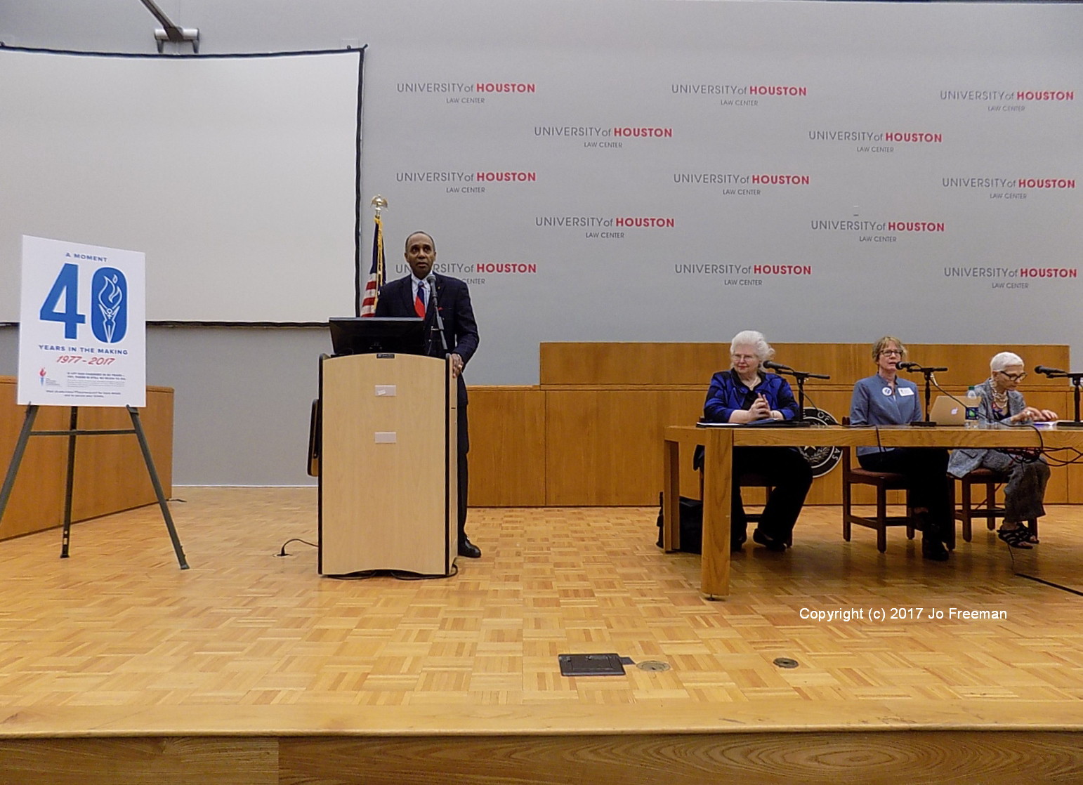 The final speakers are introduced by the Dean of the Law School at the University of Houston. In order: Sarah Weddington, moderator Nancy Beck Young and Sissy Farenthold. © Jo Freeman